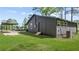 Rear home exterior with covered parking and grassy yard at 3917 Dallas Acworth Nw Hwy, Acworth, GA 30101