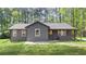Charming single-story home with a well-maintained lawn and inviting covered front porch at 3917 Dallas Acworth Nw Hwy, Acworth, GA 30101