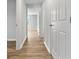 Hallway features wood-look flooring and white trim, with a bedroom visible at the end at 3917 Dallas Acworth Nw Hwy, Acworth, GA 30101