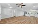 Bright, open living room with stylish ceiling fan and durable wood-look flooring at 3917 Dallas Acworth Nw Hwy, Acworth, GA 30101