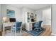 Well-lit home office with matching desks, office chairs, bookcases, and seaside themed wall decor at 3917 Dallas Acworth Nw Hwy, Acworth, GA 30101