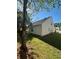 Spacious backyard with lush lawn, surrounded by mature trees, creating a private and inviting outdoor space at 4194 Wesley Ln, Decatur, GA 30035