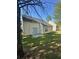Backyard featuring a sliding glass door leading to a small patio area with lawn at 4194 Wesley Ln, Decatur, GA 30035