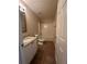 Bathroom features a single sink vanity with granite countertop and white cabinets, with a shower-tub combination at 4194 Wesley Ln, Decatur, GA 30035