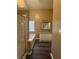 Bathroom featuring tub, walk-in shower, updated cabinets and floors, and natural lighting at 4194 Wesley Ln, Decatur, GA 30035