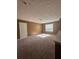 Bright and spacious bedroom with neutral paint, large window allowing in ample natural light and plush carpeting at 4194 Wesley Ln, Decatur, GA 30035