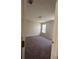 A cozy bedroom with neutral walls and plush carpeting providing a comfortable and inviting space at 4194 Wesley Ln, Decatur, GA 30035