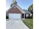 Charming single-story brick home with a two-car garage and well-maintained front yard at 4194 Wesley Ln, Decatur, GA 30035