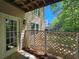 Covered porch with a door to the house, and a fence at 610 Brington Close, Alpharetta, GA 30022