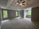 Large primary bedroom with neutral walls, carpeted floors and natural light from multiple windows at 610 Brington Close, Alpharetta, GA 30022