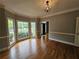 Dining room with hardwood floors, bay window and decorative lighting at 610 Brington Close, Alpharetta, GA 30022