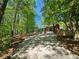 Private driveway entrance surrounded by tall trees at 610 Brington Close, Alpharetta, GA 30022