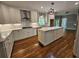 Open kitchen with granite countertops, an island with butcher block, and stainless steel appliances at 610 Brington Close, Alpharetta, GA 30022