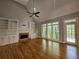 Spacious living room with vaulted ceiling, fireplace, and hardwood floors at 610 Brington Close, Alpharetta, GA 30022