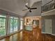 Living room with hardwood floors open to kitchen featuring vaulted ceiling at 610 Brington Close, Alpharetta, GA 30022