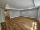Expansive living room with wood flooring, recessed lighting, and large windows for plenty of natural light at 610 Brington Close, Alpharetta, GA 30022