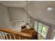 View of the living room with a fireplace, built-in shelving, hardwood floor, and lots of natural light at 610 Brington Close, Alpharetta, GA 30022