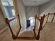 View of the staircase with wooden banisters leading to the front door and a secondary room at 610 Brington Close, Alpharetta, GA 30022