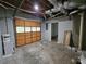 Unfinished storage area with door, exposed ductwork, and concrete floor at 610 Brington Close, Alpharetta, GA 30022