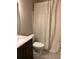 Bathroom with a modern vanity, toilet, and a shower/tub combination with a neutral curtain at 713 Parkside Dr, Woodstock, GA 30188