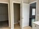 Bathroom features a half bath, a walk in closet, and tile flooring at 713 Parkside Dr, Woodstock, GA 30188