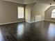Large bedroom features wood floors, two windows, and a built in dresser at 713 Parkside Dr, Woodstock, GA 30188