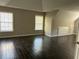 Spacious bedroom has wood floors, neutral walls, and ample closet space at 713 Parkside Dr, Woodstock, GA 30188
