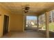 A covered patio with ceiling fans and columns providing a comfortable outdoor living space at 713 Parkside Dr, Woodstock, GA 30188