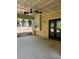 Back patio with ceiling fan overlooks the backyard and features double door access to the home at 713 Parkside Dr, Woodstock, GA 30188