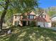 Charming brick home with manicured lawn, black shutters and a two-car garage at 713 Parkside Dr, Woodstock, GA 30188