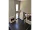 Bright living room features hardwood floors, high ceilings, fireplace, and many windows at 713 Parkside Dr, Woodstock, GA 30188