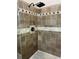 A walk in shower that features stylish tile and a rainfall shower head at 713 Parkside Dr, Woodstock, GA 30188