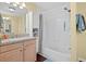 Bright bathroom with modern fixtures and a shower-tub combination at 2591 Boulder Hill Se Ct, Atlanta, GA 30316