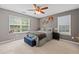Comfortable bedroom with large windows and a ceiling fan at 2591 Boulder Hill Se Ct, Atlanta, GA 30316