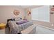 A cozy bedroom features natural light and a calm atmosphere at 2591 Boulder Hill Se Ct, Atlanta, GA 30316