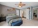 Spacious bedroom with ensuite bathroom featuring a view into office space at 2591 Boulder Hill Se Ct, Atlanta, GA 30316