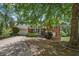 Brick and siding exterior with a ramp to the front door for accessibility and mature trees at 2591 Boulder Hill Se Ct, Atlanta, GA 30316