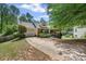 Two-story home with a driveway, landscaped front yard, and a ramp for accessibility at 2591 Boulder Hill Se Ct, Atlanta, GA 30316