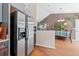 Open concept kitchen with stainless steel refrigerator and view to dining area at 2591 Boulder Hill Se Ct, Atlanta, GA 30316