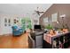 Cozy living room with hardwood floors, vaulted ceiling, and natural light from the window at 2591 Boulder Hill Se Ct, Atlanta, GA 30316