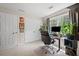 Bright office space with a work space and a large window providing natural light and lush green views at 2591 Boulder Hill Se Ct, Atlanta, GA 30316
