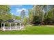 Scenic backyard featuring a gazebo, swing set, and picnic area, creating an idyllic outdoor retreat at 3 Woodlawn Ne Dr, Marietta, GA 30067