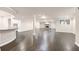 Finished basement with dark wood floors, a bar area, and a stone fireplace at 3 Woodlawn Ne Dr, Marietta, GA 30067