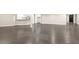 Large finished basement featuring hardwood flooring, neutral walls, and a bar area, perfect for relaxing at 3 Woodlawn Ne Dr, Marietta, GA 30067