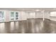 Spacious finished basement with wood floors, recessed lighting, and a bar area, perfect for entertaining at 3 Woodlawn Ne Dr, Marietta, GA 30067