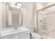 Bathroom featuring a vanity and a tiled walk-in shower with glass enclosure at 3 Woodlawn Ne Dr, Marietta, GA 30067