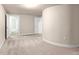 Neutral bedroom with a curved wall, carpeted floor, and two doors leading to other areas of the house at 3 Woodlawn Ne Dr, Marietta, GA 30067