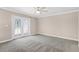 Spacious, bright bedroom with carpet, ceiling fan, and French doors leading to a backyard at 3 Woodlawn Ne Dr, Marietta, GA 30067