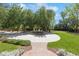 This circular driveway features lush landscaping and a central water feature, creating a grand entrance to the property at 3 Woodlawn Ne Dr, Marietta, GA 30067