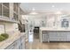 Open kitchen layout with marble countertops, stainless appliances, and hardwood floors at 3 Woodlawn Ne Dr, Marietta, GA 30067